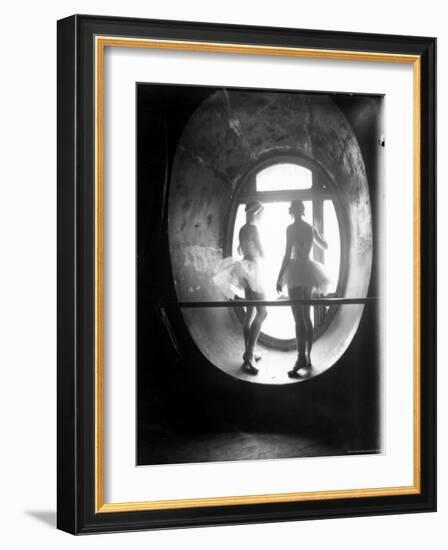 Two Ballerinas Standing in Window of the Paris Opera During Rehearsal of "Swan Lake"-Alfred Eisenstaedt-Framed Photographic Print