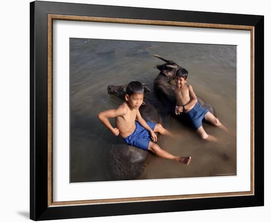 Two Boys Bathe with Their Water Buffalo in the Mekong River, Eastern Cambodia, Indochina-Andrew Mcconnell-Framed Photographic Print