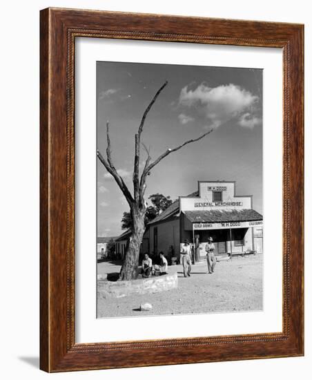 Two Boys Playing Nr. a Dead Tree as Judge Roy Langrty and a Man Walk Past a General Store-Alfred Eisenstaedt-Framed Photographic Print