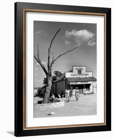 Two Boys Playing Nr. a Dead Tree as Judge Roy Langrty and a Man Walk Past a General Store-Alfred Eisenstaedt-Framed Photographic Print