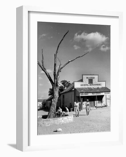 Two Boys Playing Nr. a Dead Tree as Judge Roy Langrty and a Man Walk Past a General Store-Alfred Eisenstaedt-Framed Photographic Print