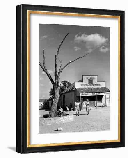 Two Boys Playing Nr. a Dead Tree as Judge Roy Langrty and a Man Walk Past a General Store-Alfred Eisenstaedt-Framed Photographic Print