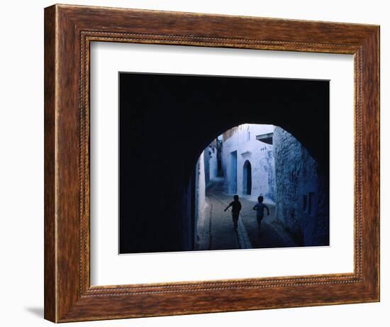 Two Boys Running Through Kasbah, Chefchaouen, Morocco-Jeffrey Becom-Framed Photographic Print