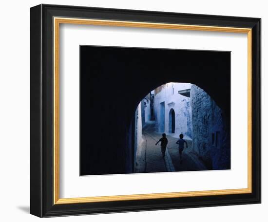 Two Boys Running Through Kasbah, Chefchaouen, Morocco-Jeffrey Becom-Framed Photographic Print