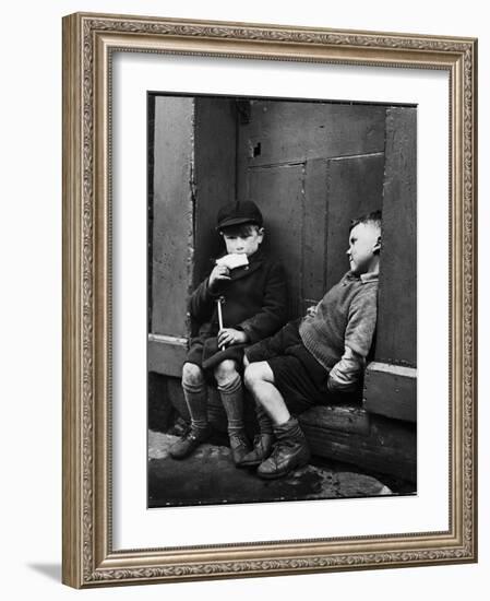 Two Boys Sitting on Doorstep-Nat Farbman-Framed Photographic Print