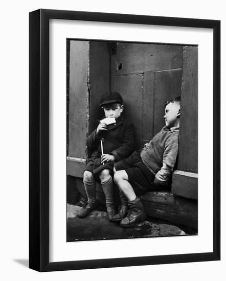 Two Boys Sitting on Doorstep-Nat Farbman-Framed Photographic Print