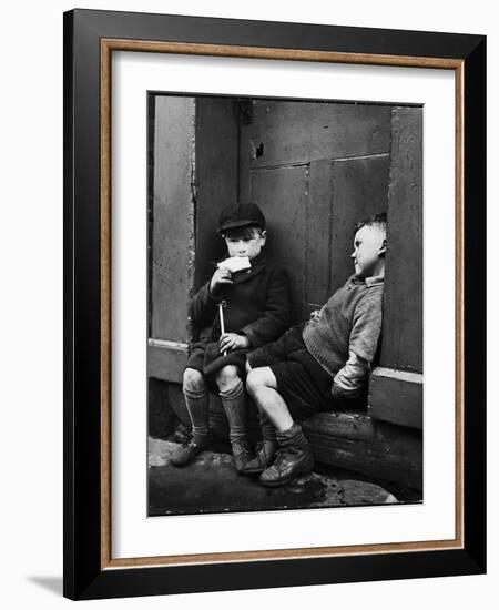 Two Boys Sitting on Doorstep-Nat Farbman-Framed Photographic Print