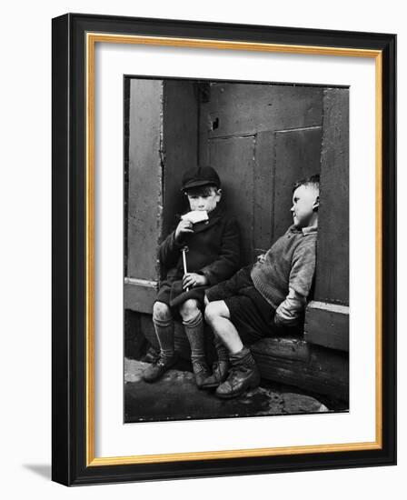 Two Boys Sitting on Doorstep-Nat Farbman-Framed Photographic Print
