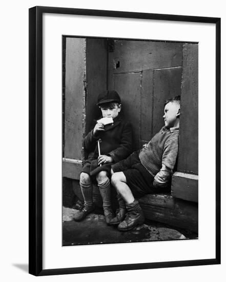 Two Boys Sitting on Doorstep-Nat Farbman-Framed Photographic Print