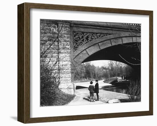 Two Boys Standing under the Ornate Arch of a Bridge in Prospect Park, Brooklyn, Ny-Wallace G^ Levison-Framed Photographic Print