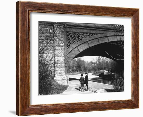 Two Boys Standing under the Ornate Arch of a Bridge in Prospect Park, Brooklyn, Ny-Wallace G^ Levison-Framed Photographic Print