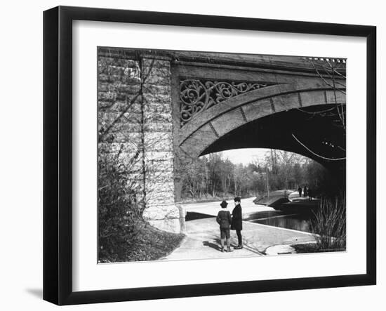 Two Boys Standing under the Ornate Arch of a Bridge in Prospect Park, Brooklyn, Ny-Wallace G^ Levison-Framed Photographic Print