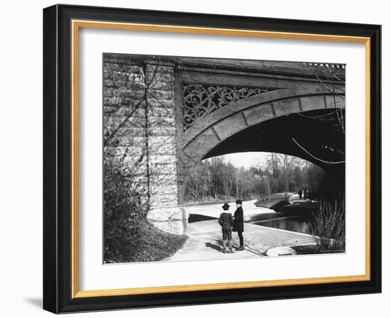 Two Boys Standing under the Ornate Arch of a Bridge in Prospect Park, Brooklyn, Ny-Wallace G^ Levison-Framed Photographic Print