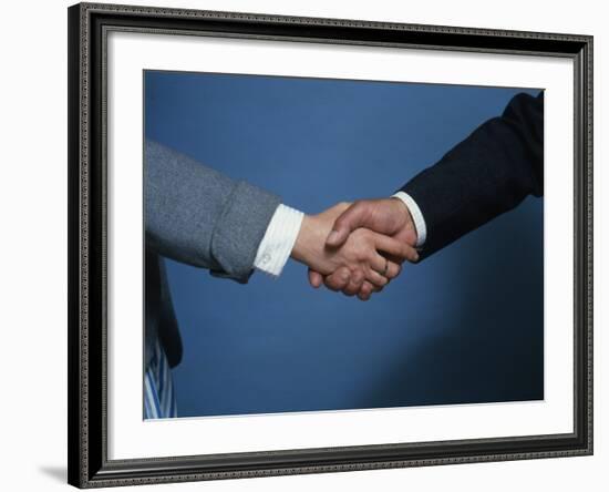 Two Businessmen Shake Hands-null-Framed Photographic Print