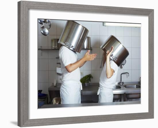 Two Chefs Having Discussion with Large Pans on their Heads-Robert Kneschke-Framed Photographic Print