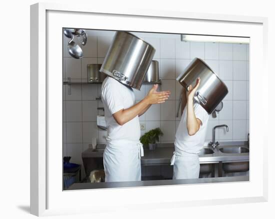 Two Chefs Having Discussion with Large Pans on their Heads-Robert Kneschke-Framed Photographic Print