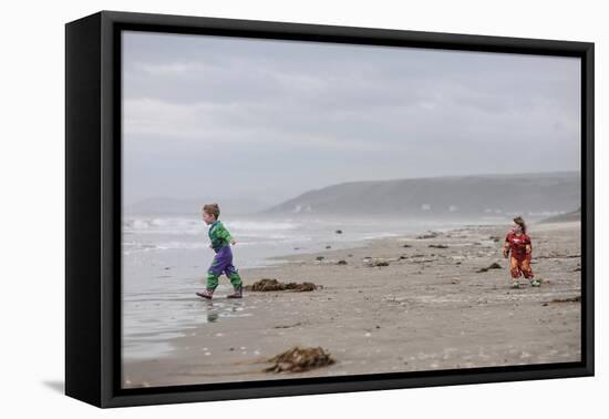 Two Children Playing on a Beach-Clive Nolan-Framed Premier Image Canvas