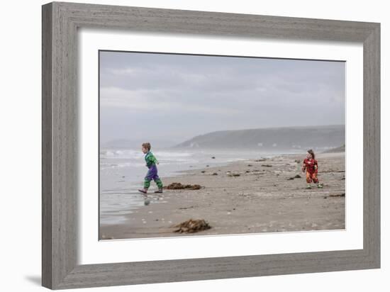 Two Children Playing on a Beach-Clive Nolan-Framed Photographic Print