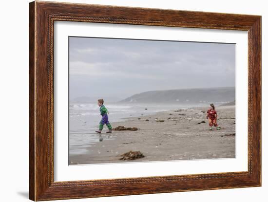 Two Children Playing on a Beach-Clive Nolan-Framed Photographic Print