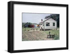 Two Children Stand in a Yard under a Laundry Line, Edisto Island, South Carolina, 1956-Walter Sanders-Framed Photographic Print