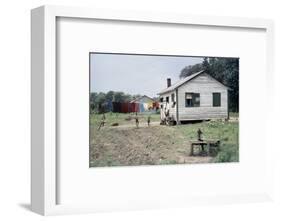 Two Children Stand in a Yard under a Laundry Line, Edisto Island, South Carolina, 1956-Walter Sanders-Framed Photographic Print