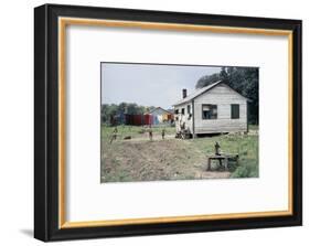 Two Children Stand in a Yard under a Laundry Line, Edisto Island, South Carolina, 1956-Walter Sanders-Framed Photographic Print