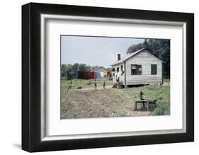 Two Children Stand in a Yard under a Laundry Line, Edisto Island, South Carolina, 1956-Walter Sanders-Framed Photographic Print