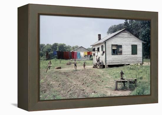 Two Children Stand in a Yard under a Laundry Line, Edisto Island, South Carolina, 1956-Walter Sanders-Framed Premier Image Canvas