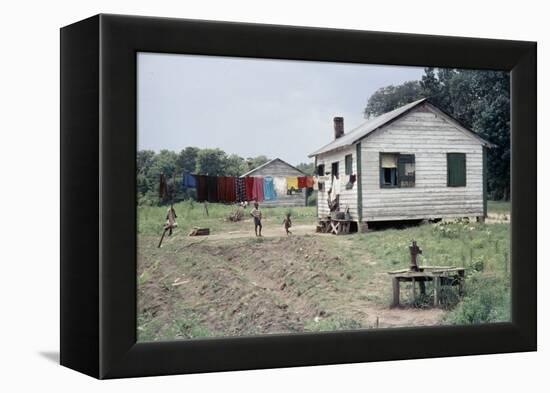 Two Children Stand in a Yard under a Laundry Line, Edisto Island, South Carolina, 1956-Walter Sanders-Framed Premier Image Canvas