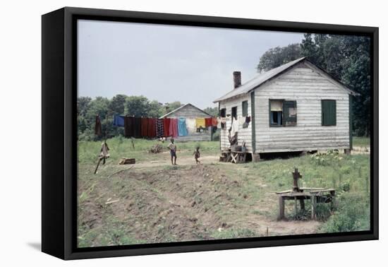 Two Children Stand in a Yard under a Laundry Line, Edisto Island, South Carolina, 1956-Walter Sanders-Framed Premier Image Canvas