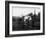 Two Children Stand on a Fence and Wave a Handkerchief at a Passing Steam Train-Staniland Pugh-Framed Photographic Print