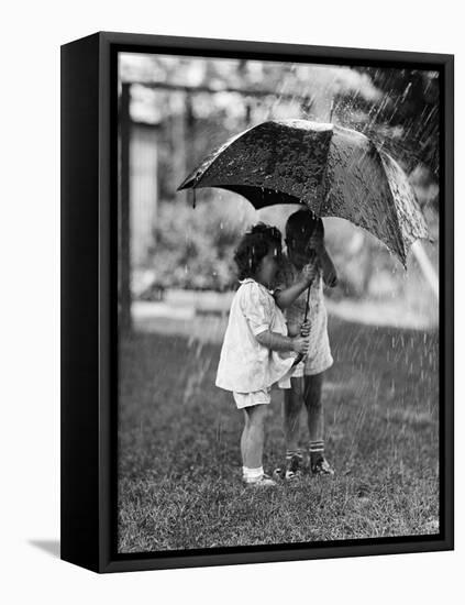 Two Children under Umbrella During a Downpour-Philip Gendreau-Framed Premier Image Canvas