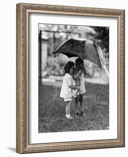 Two Children under Umbrella During a Downpour-Philip Gendreau-Framed Photographic Print