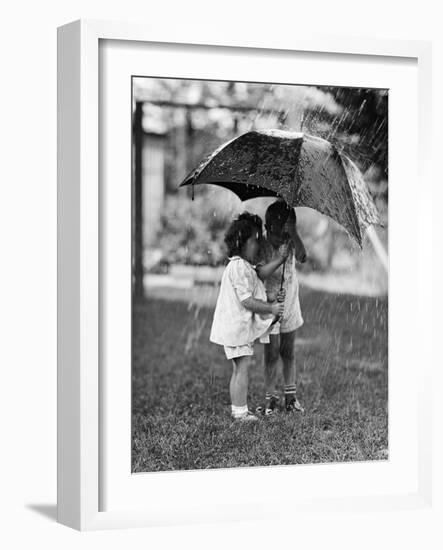 Two Children under Umbrella During a Downpour-Philip Gendreau-Framed Photographic Print