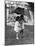 Two Children under Umbrella During a Downpour-Philip Gendreau-Mounted Photographic Print