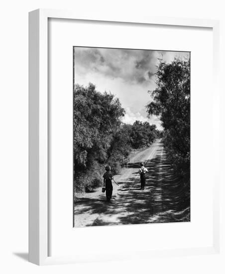 Two Children Walking Down a Dirt Road Going Fishing on a Summer Day-John Dominis-Framed Photographic Print