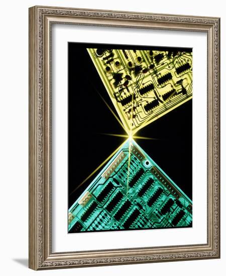 Two Circuit Boards Meeting At a Spot of Light.-Tony Craddock-Framed Photographic Print