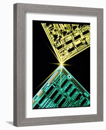 Two Circuit Boards Meeting At a Spot of Light.-Tony Craddock-Framed Photographic Print