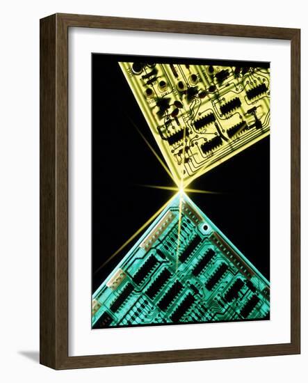 Two Circuit Boards Meeting At a Spot of Light.-Tony Craddock-Framed Photographic Print