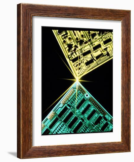 Two Circuit Boards Meeting At a Spot of Light.-Tony Craddock-Framed Photographic Print