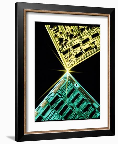 Two Circuit Boards Meeting At a Spot of Light.-Tony Craddock-Framed Photographic Print