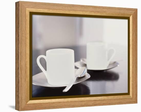 Two coffee cups on a table-null-Framed Premier Image Canvas
