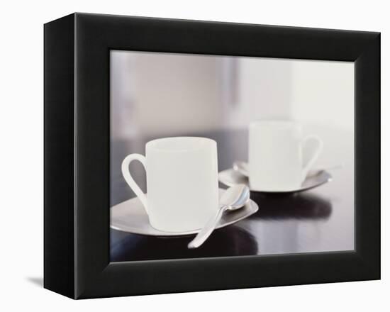 Two coffee cups on a table-null-Framed Premier Image Canvas