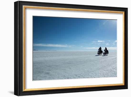 Two Cyclists Cycle in the Morning over the Salar De Uyuni-Alex Saberi-Framed Photographic Print