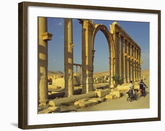 Two Cyclists Pass the Great Colonnade (Cardo), Palmyra, Unesco World Heritage Site, Syria-Eitan Simanor-Framed Photographic Print