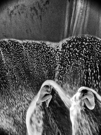Two Dancers in the Surf on a Remote Beach at Tortuguero National Park