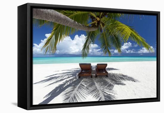 Two deck chairs under palm trees and tropical beach, The Maldives, Indian Ocean, Asia-Sakis Papadopoulos-Framed Premier Image Canvas
