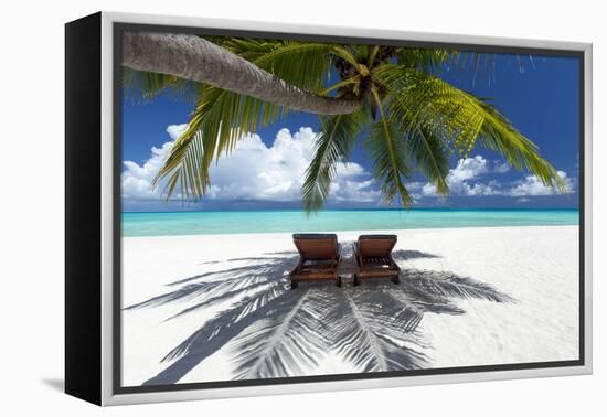 Two deck chairs under palm trees and tropical beach, The Maldives, Indian Ocean, Asia-Sakis Papadopoulos-Framed Premier Image Canvas