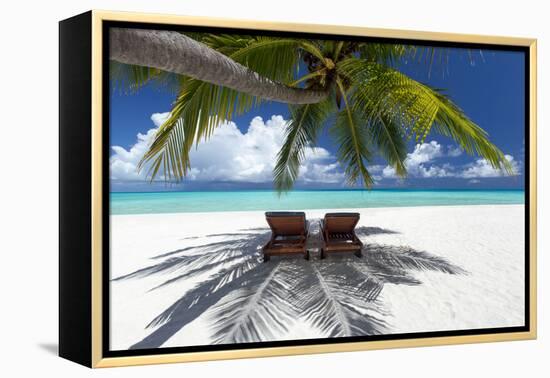 Two deck chairs under palm trees and tropical beach, The Maldives, Indian Ocean, Asia-Sakis Papadopoulos-Framed Premier Image Canvas