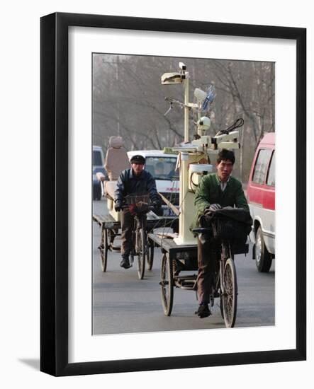 Two Delivery Riders Carry a Dentists Drill and Chair Along a Beijing Street January 4-null-Framed Photographic Print